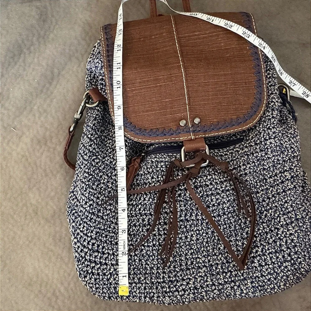 The Sak Brown & Navy Woven Backpack with Tassel Fringe and Embroidered Strap